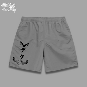 A pair of black gymwear shorts with a white minimalist anime design on the left leg.