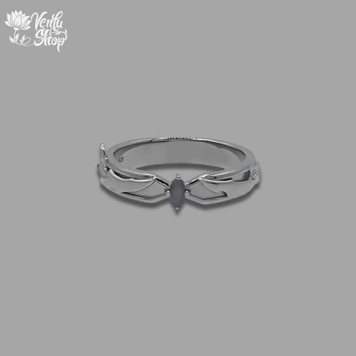 Jin Woo-inspired design Silver ring with a central gemstone on a gray background
