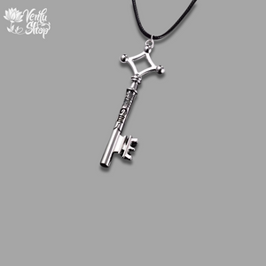 AOT-inspired design Silver key-shaped pendant on a black cord against a gray background